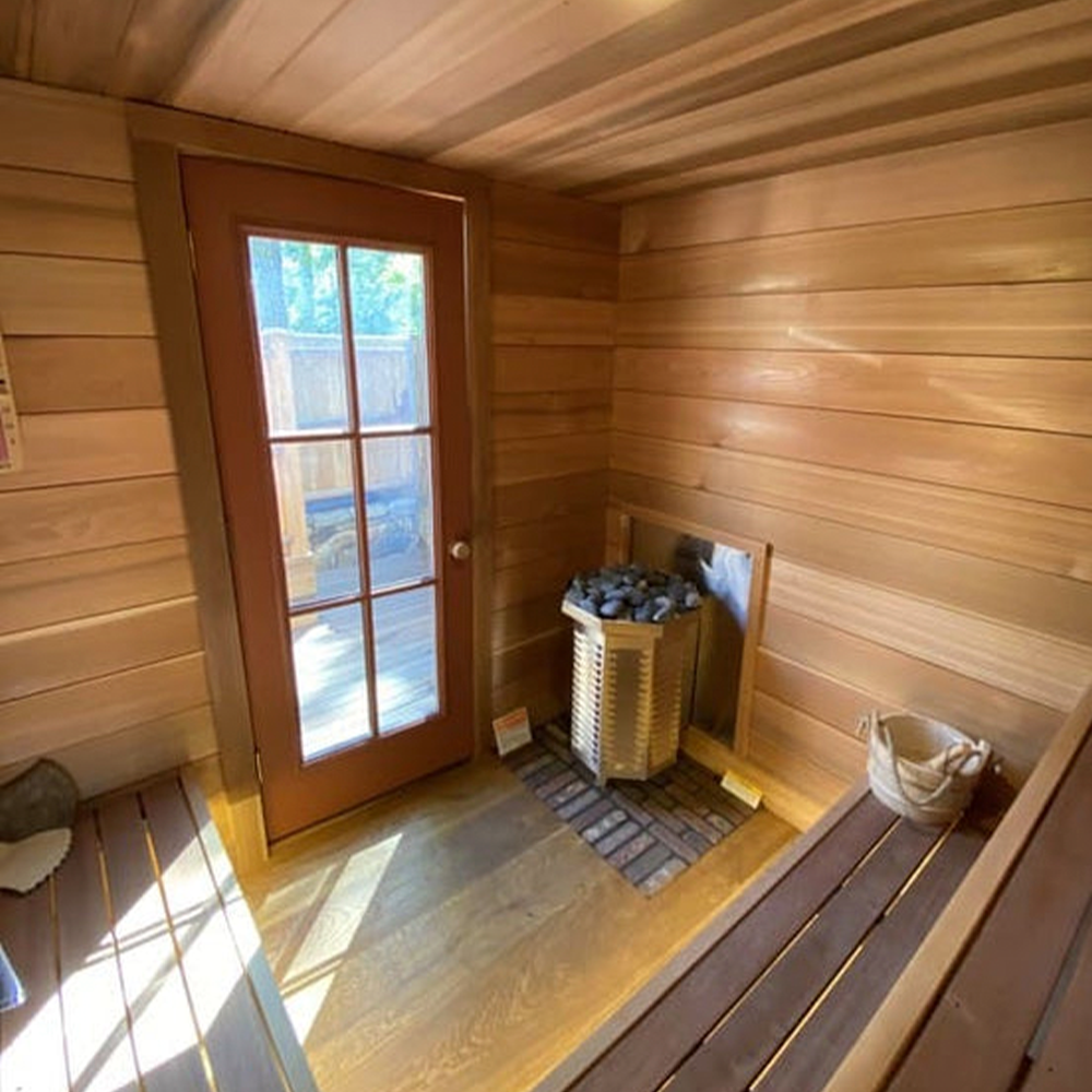 Gas sauna heater inside a sauna room