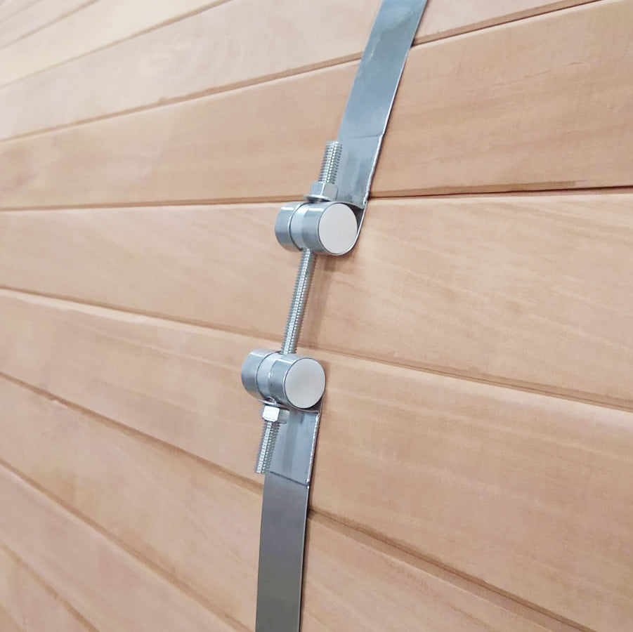 Steel band detail on a cedar barrel sauna