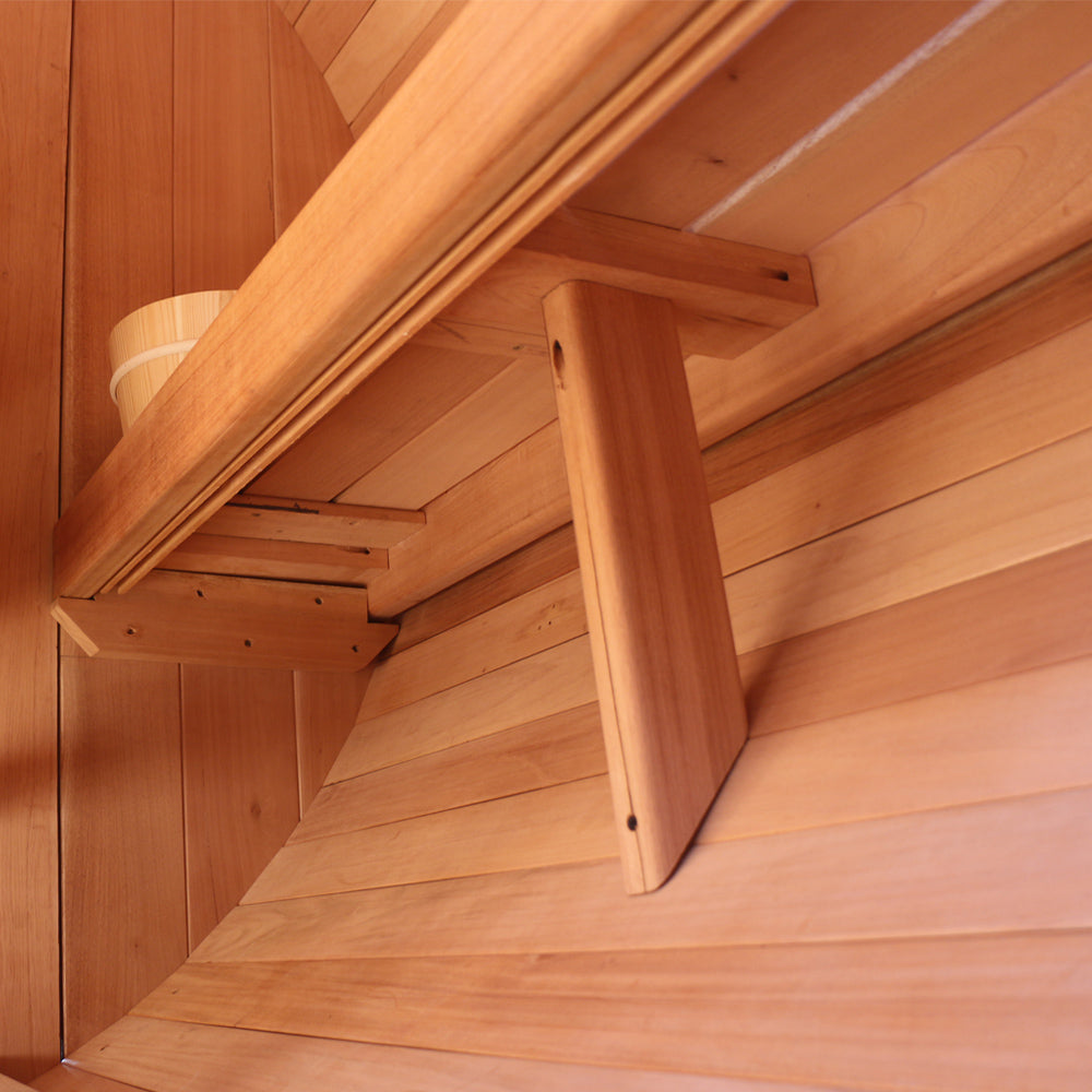 Cedar benches inside a barrel sauna